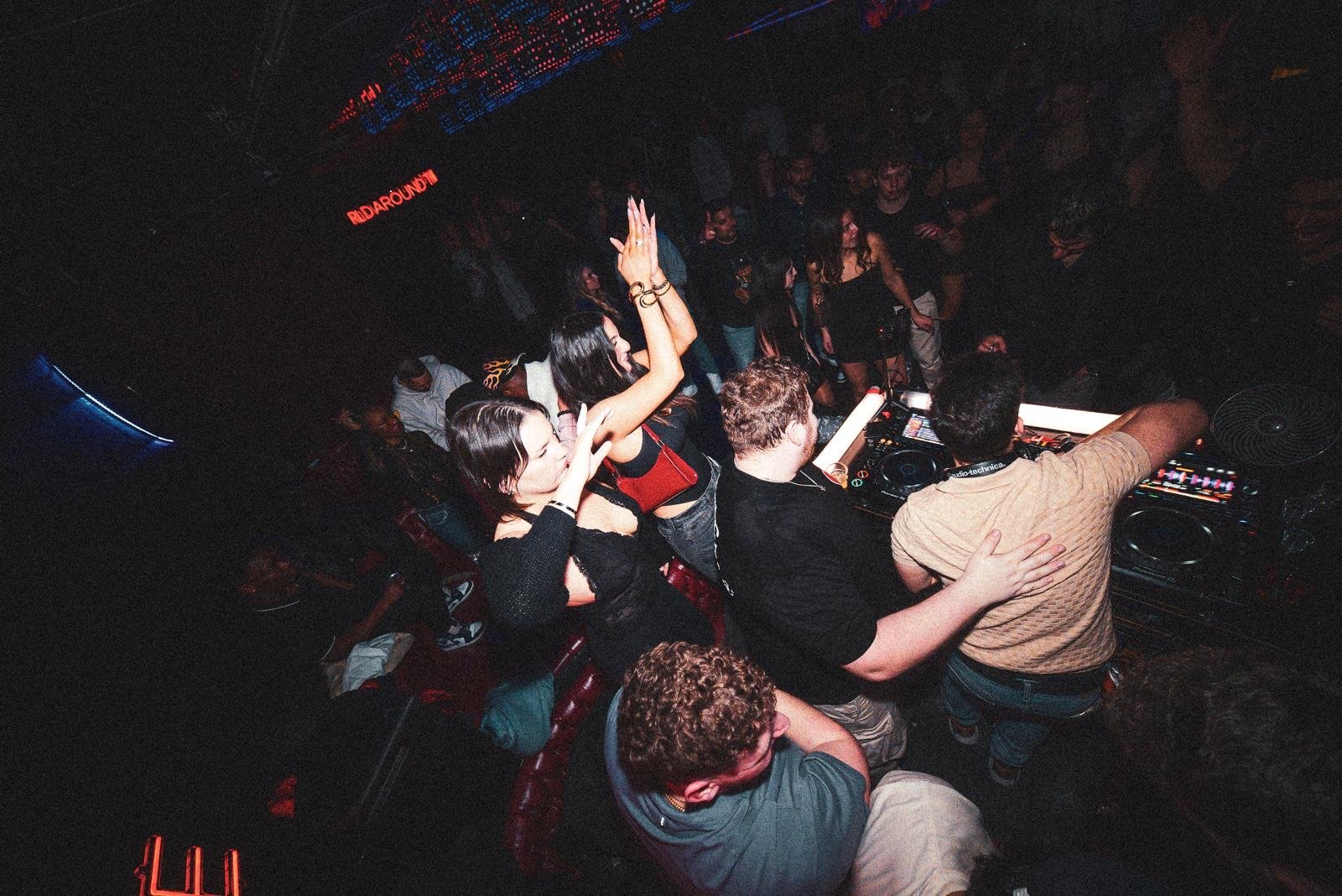 Guests dancing around the DJ booth